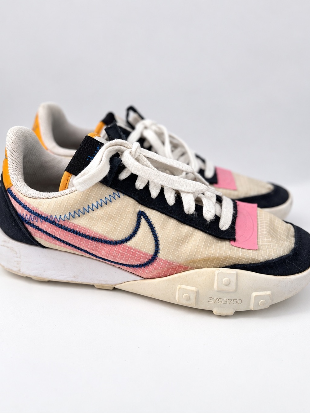 Nike women’s Cream and Black Low-Top Sneakers with Pink Accent
